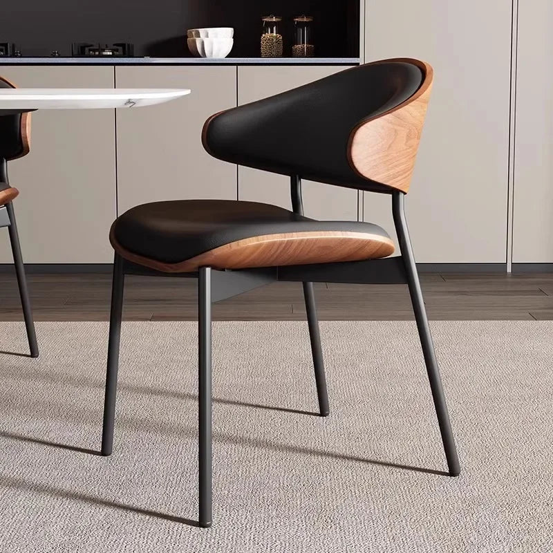 Fontaine Collection | Geometric Leather-Wrapped Cognac Leather Dining Chairs - presented at scale within a designed interior in a Mid-Century Modern dining room setting.