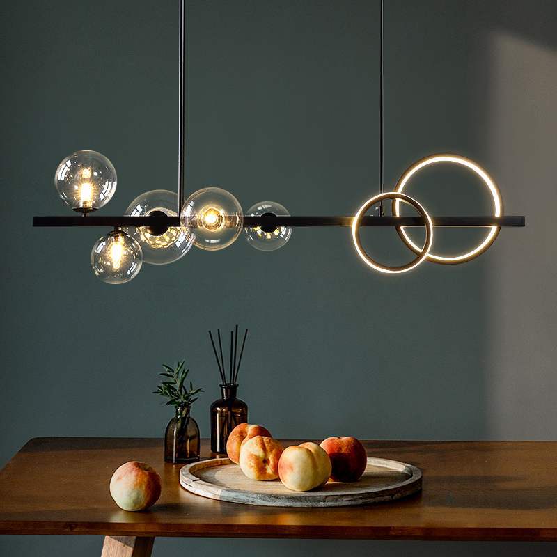Belmont Collection | Sculptural Iron-Framed Blackened Iron Pendant - showcasing full sculptural form and curated finish in a Mid-Century Modern living room setting.