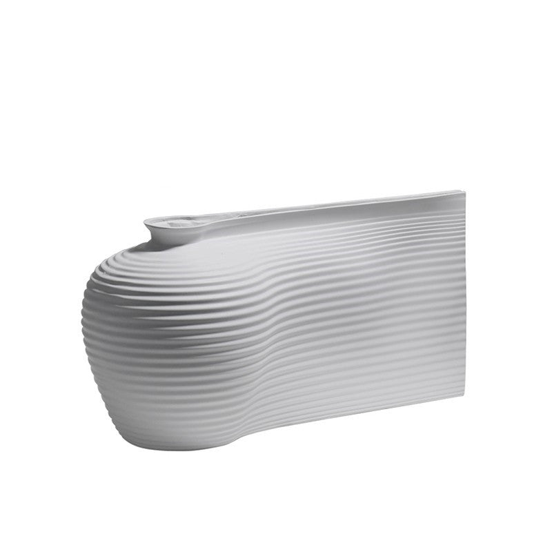 Fontaine Collection | Splayed-Leg Nordic Ceramic Vessel - featuring close-up joinery and artisanal finish quality in a Mid-Century Modern living room setting.