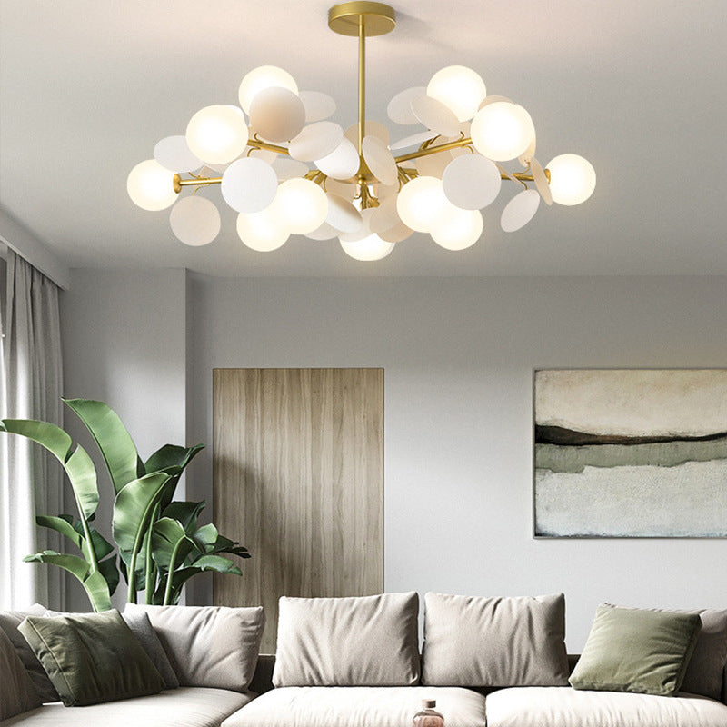 Ellington Collection | Geometric Brass-Accented Brass Chandelier - showcasing full sculptural form and curated finish in a Mid-Century Modern living room setting.