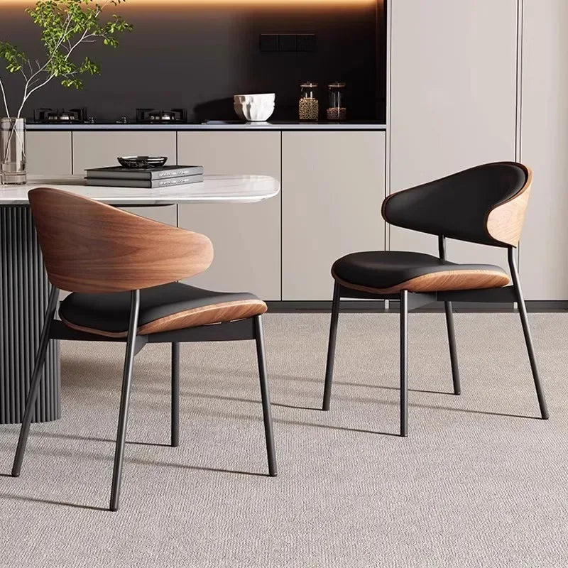 Fontaine Collection | Geometric Leather-Wrapped Cognac Leather Dining Chairs - showcasing full sculptural form and curated finish in a Mid-Century Modern dining room setting.