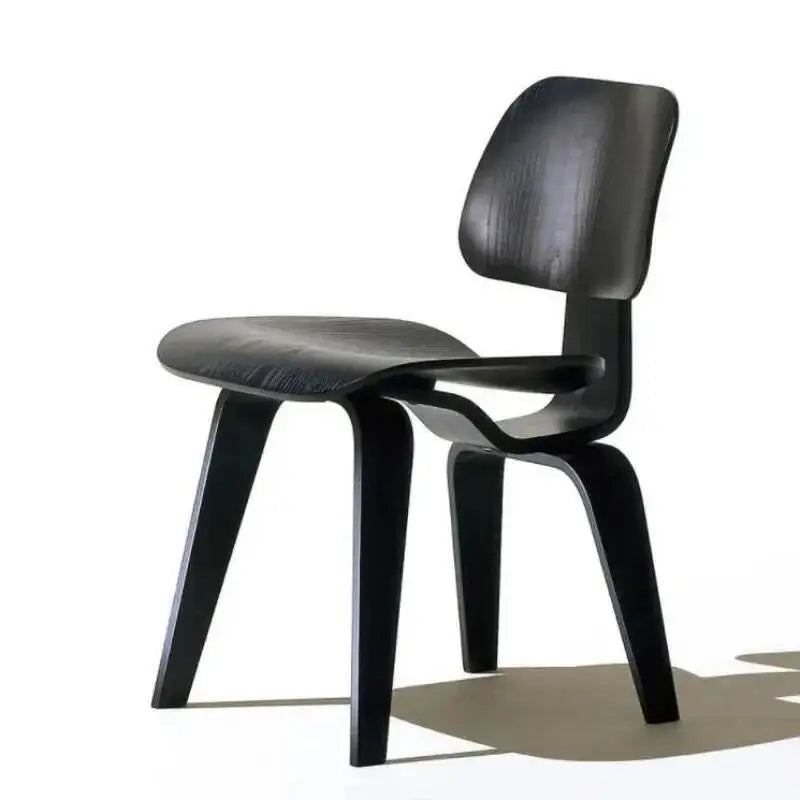 Fontaine Collection | Curved Molded Plywood Dining Chair - showcasing full sculptural form and curated finish in a Mid-Century Modern dining room setting.