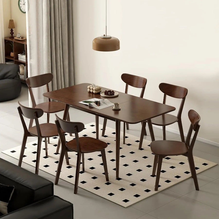 Astoria Collection | Tapered-Leg Atomic-Era Expandable Oak Dining Table - showcasing full sculptural form and curated finish in a Mid-Century Modern dining room setting.