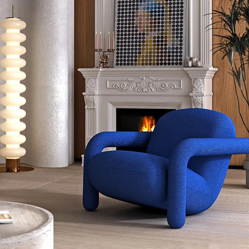 Ellington Collection | Sculptural Velvet-Cushioned Royal Blue Velvet Accent Chair - showcasing full sculptural form and curated finish in a Mid-Century Modern living room setting.