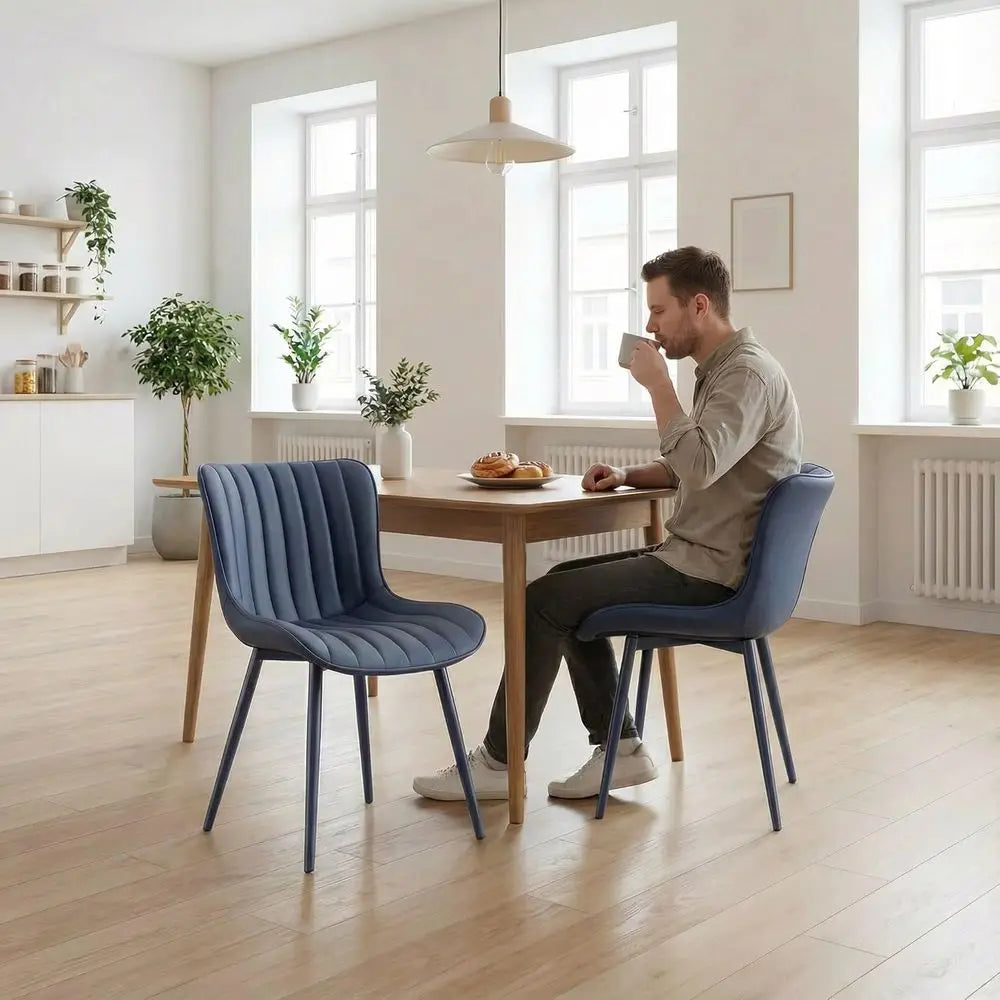 Kensington Collection | Geometric Leather-Wrapped Navy Leatherette Dining Chair - presented at scale within a designed interior in a Mid-Century Modern dining room setting.