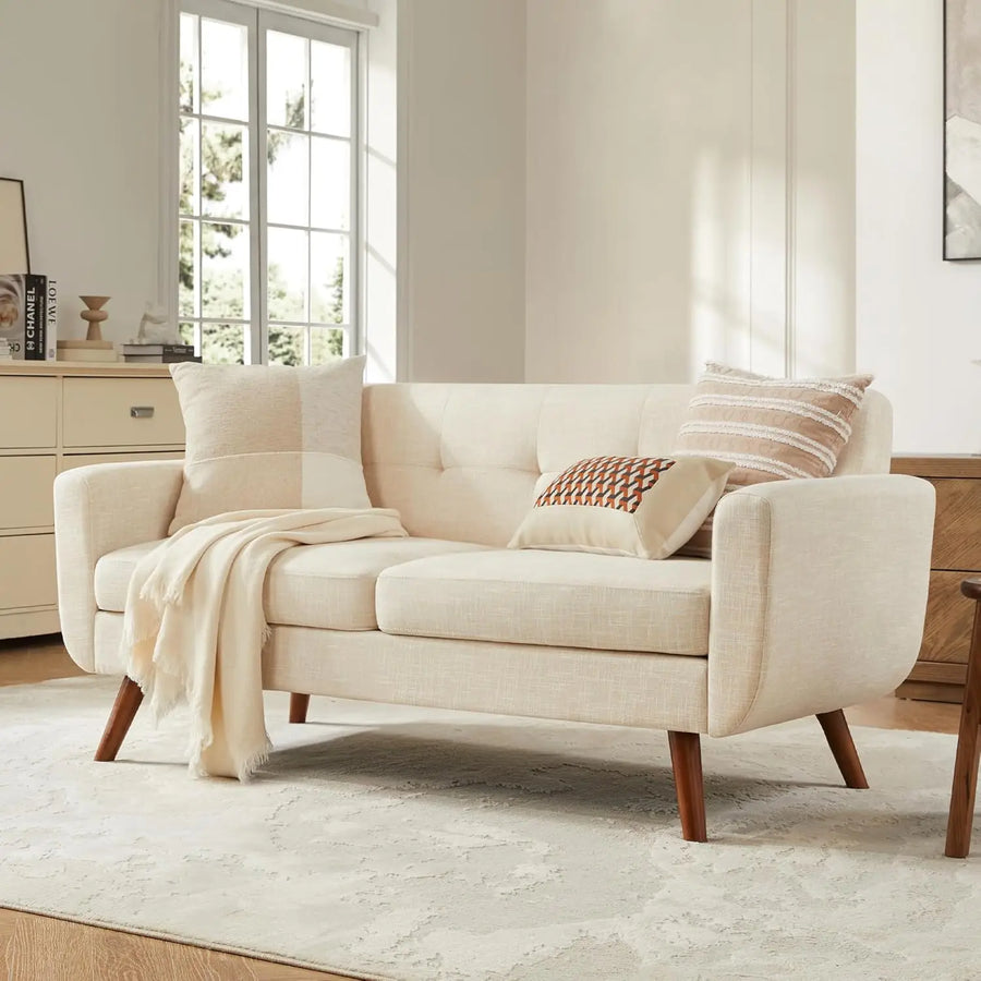 Ellington Collection | Sculptural Atomic-Era Button-Tufted Loveseat - showcasing full sculptural form and curated finish in a Mid-Century Modern living room setting.