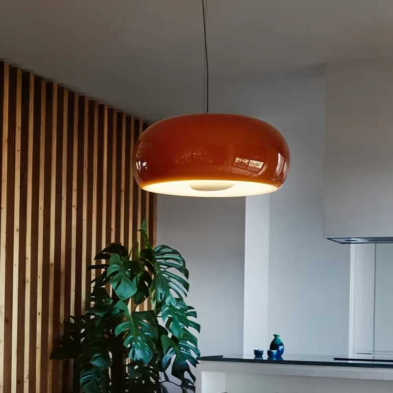 Astoria Collection | Streamlined Glass-Topped Ruby Glass Pendant - showcasing full sculptural form and curated finish in a Mid-Century Modern living room setting.