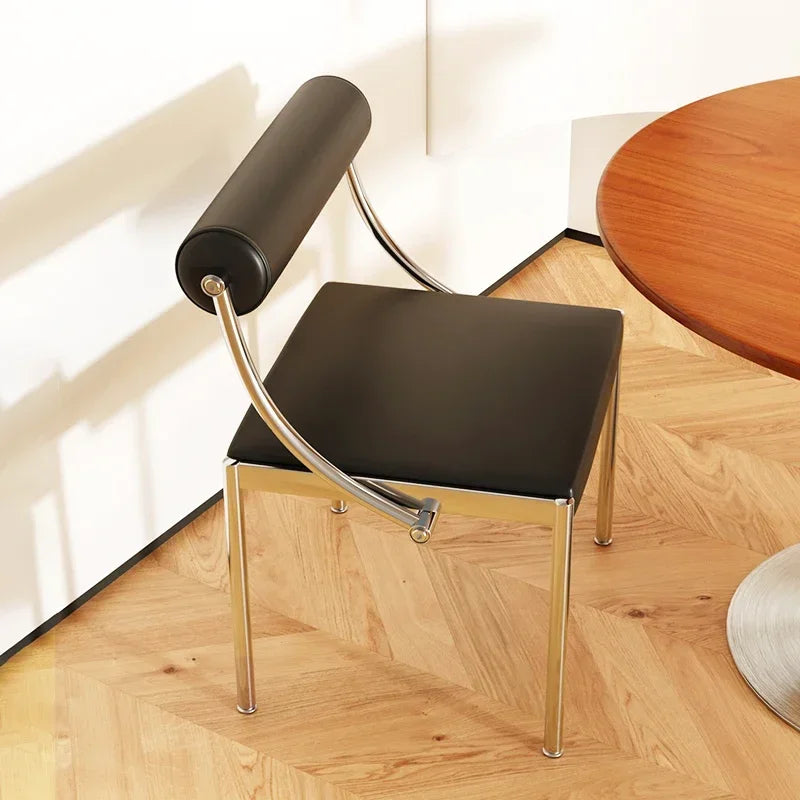 Fontaine Collection | Arched Steel-Framed Brushed Steel Dining Chair - showcasing full sculptural form and curated finish in a Mid-Century Modern dining room setting.